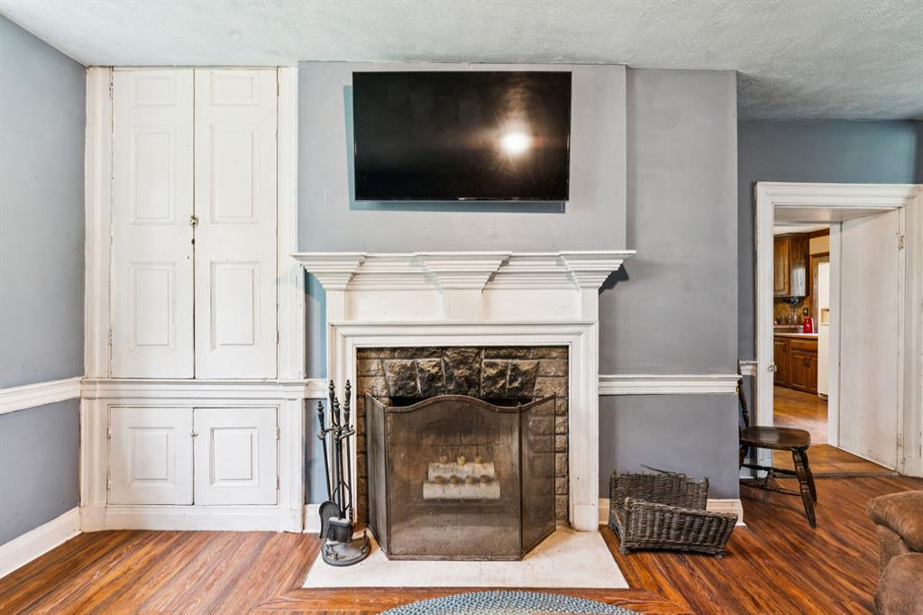 1010 Beaner Hollow Road Beaver, PA 15009 - Photo 20 of 48 a living room with a fireplace and a flat screen tv