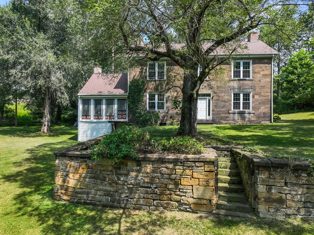 1010 Beaner Hollow Road Beaver, PA 15009 - Photo 2 of 48 a front view of a house with a yard