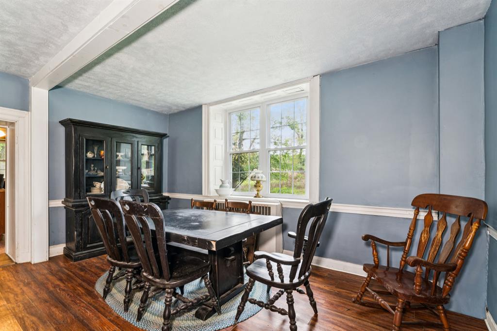 1010 Beaner Hollow Road Beaver, PA 15009 - Photo 25 of 48 a view of a dining room with furniture window and wooden floor