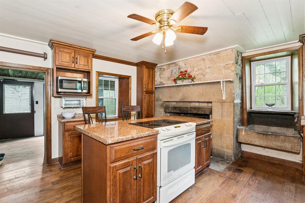 1010 Beaner Hollow Road Beaver, PA 15009 - Photo 27 of 48 a kitchen that has a stove and a table in it
