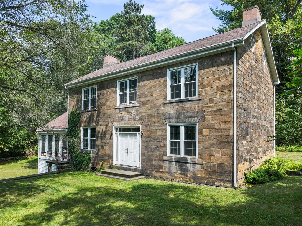 1010 Beaner Hollow Road Beaver, PA 15009 - Photo 5 of 48 a front view of a house with a garden