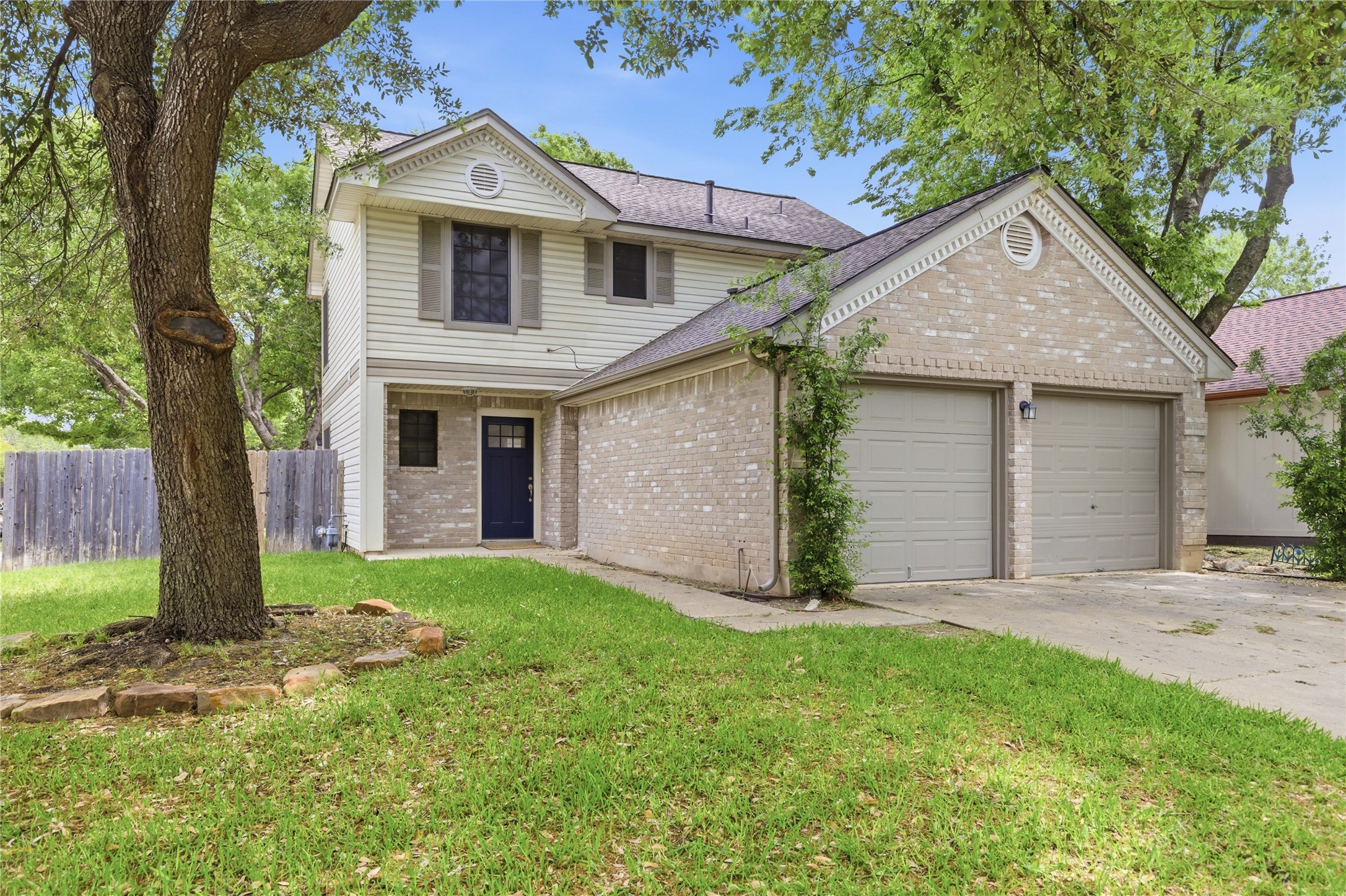 2326 Dowd Lane Austin, TX 78728 - Photo 1 of 30 a front view of a house with a yard and garage