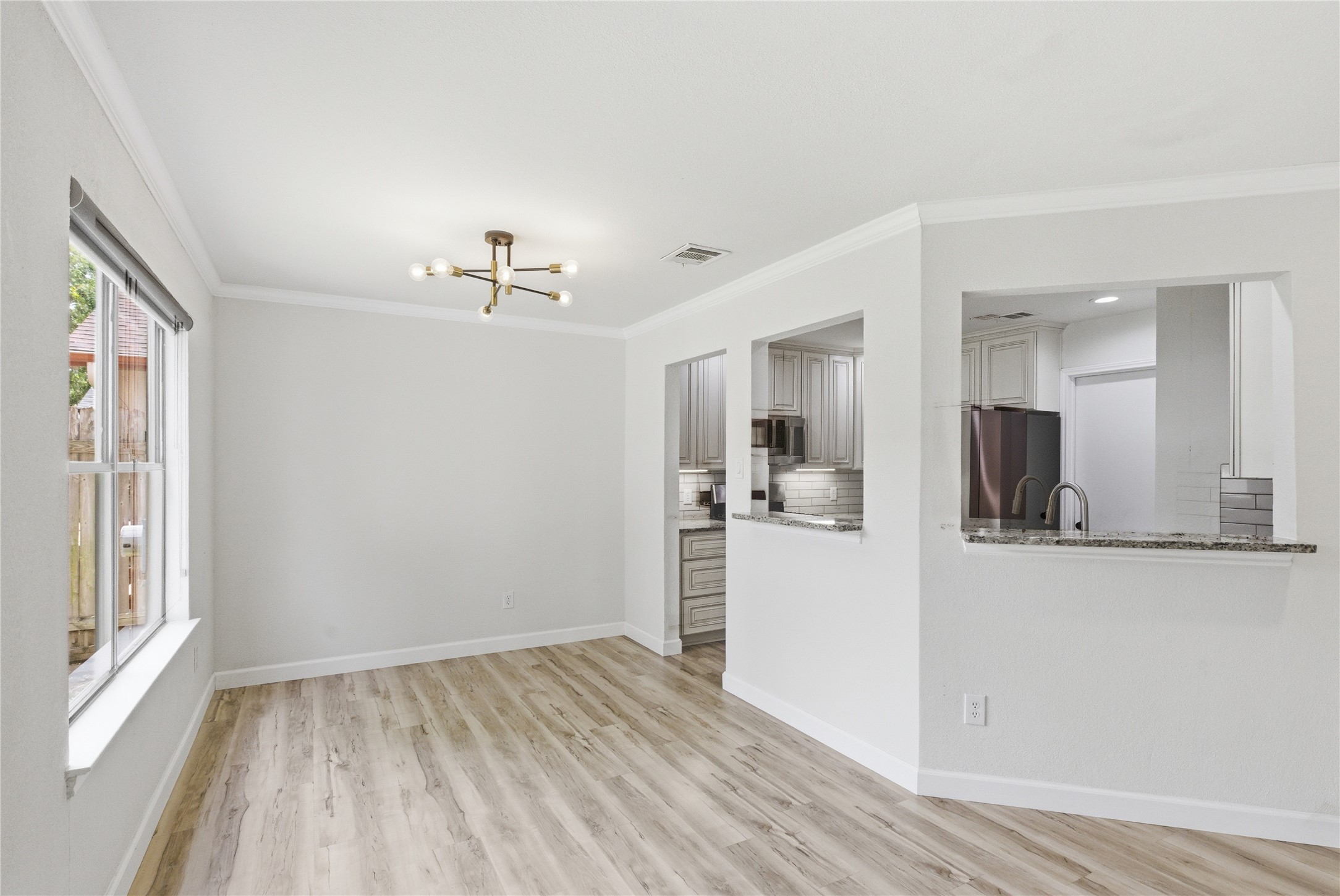 2326 Dowd Lane Austin, TX 78728 - Photo 13 of 30 a view of a kitchen with wooden floor and a kitchen