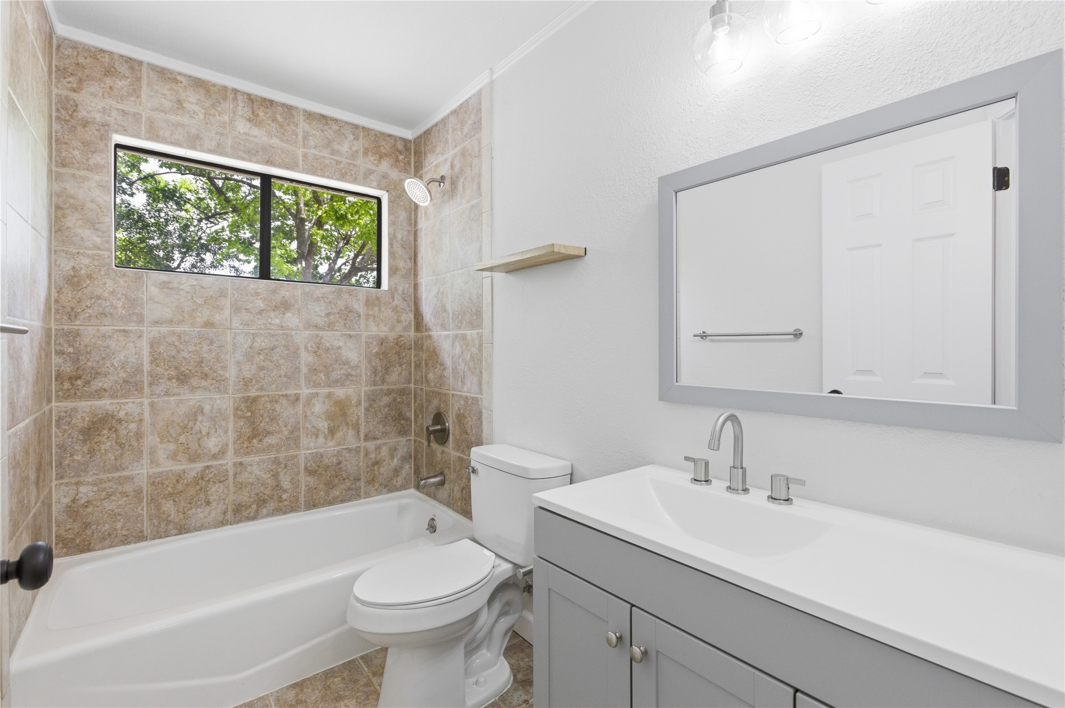 2326 Dowd Lane Austin, TX 78728 - Photo 17 of 30 a bathroom with a sink a toilet and a bathtub