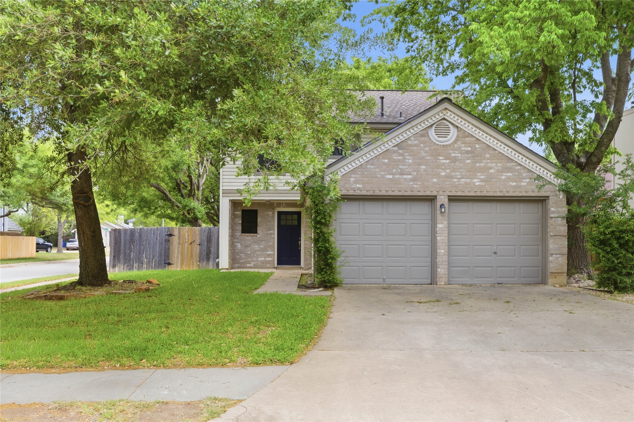 2326 Dowd Lane Austin, TX 78728 - Photo 25 of 30 front view of a house with a yard and a large tree