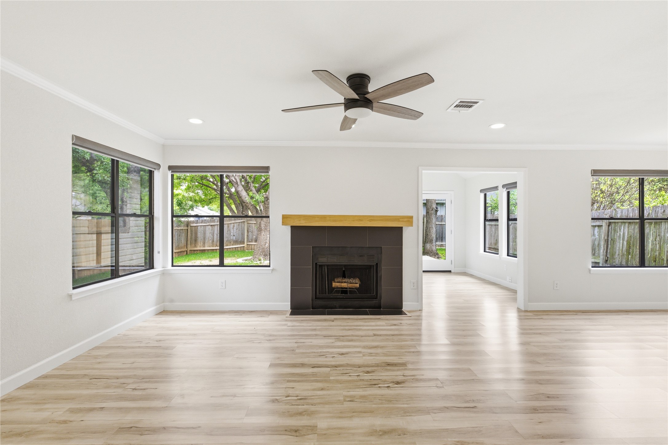 2326 Dowd Lane Austin, TX 78728 - Photo 3 of 30 a view of an empty room with window and fire place