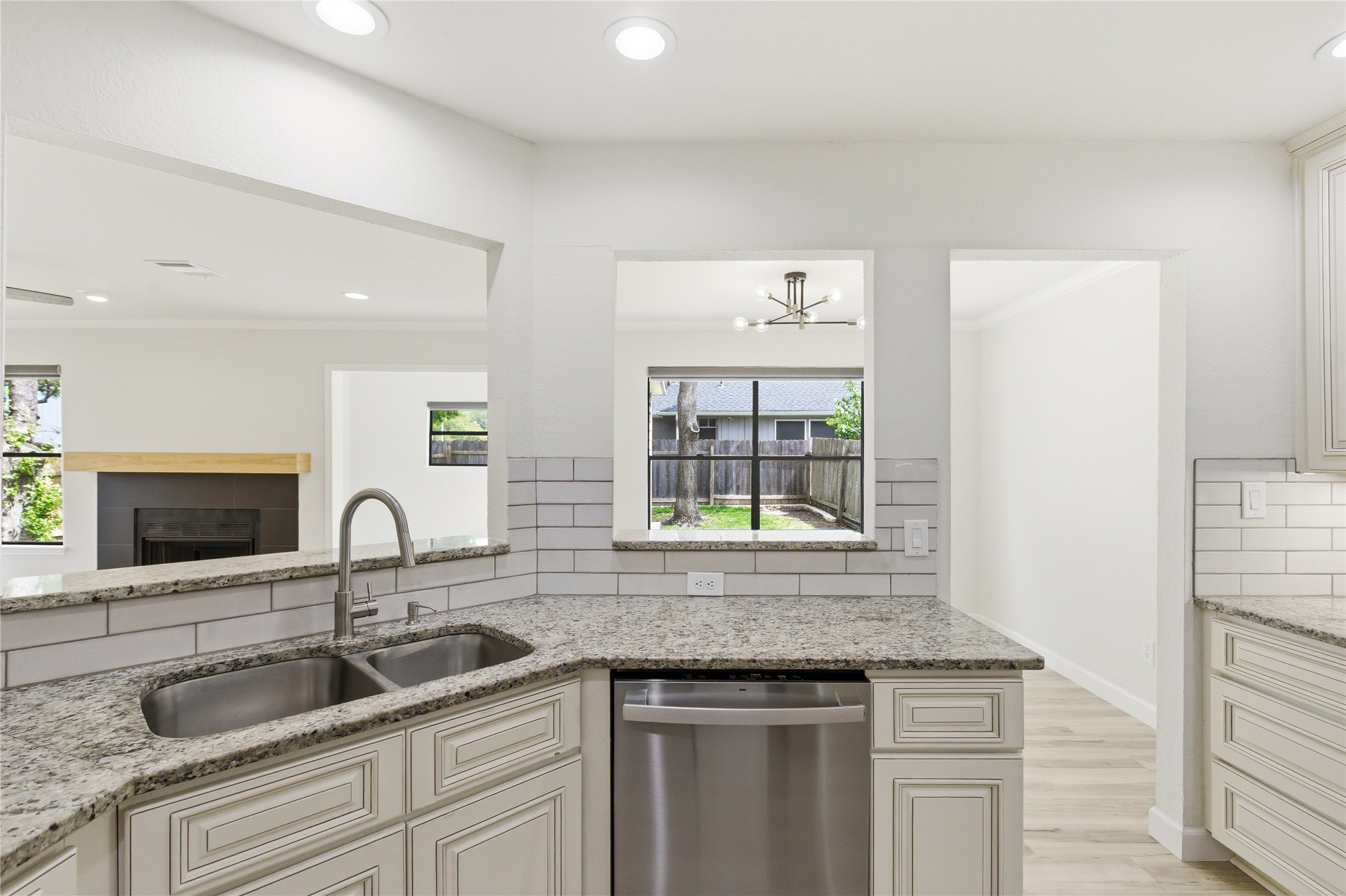2326 Dowd Lane Austin, TX 78728 - Photo 5 of 30 a kitchen with granite countertop a sink and a window