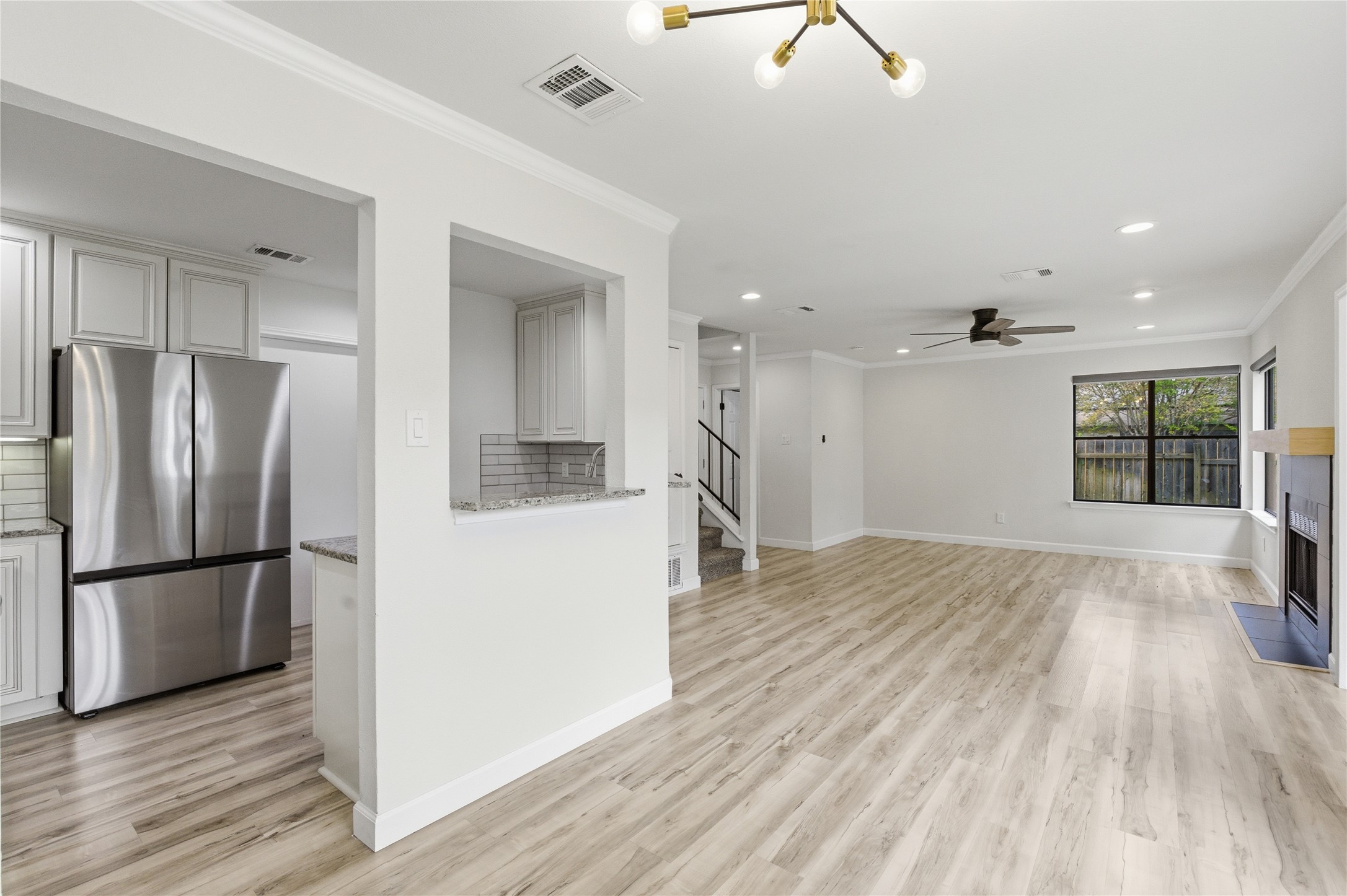 2326 Dowd Lane Austin, TX 78728 - Photo 8 of 30 a view of kitchen center island wooden floor and window