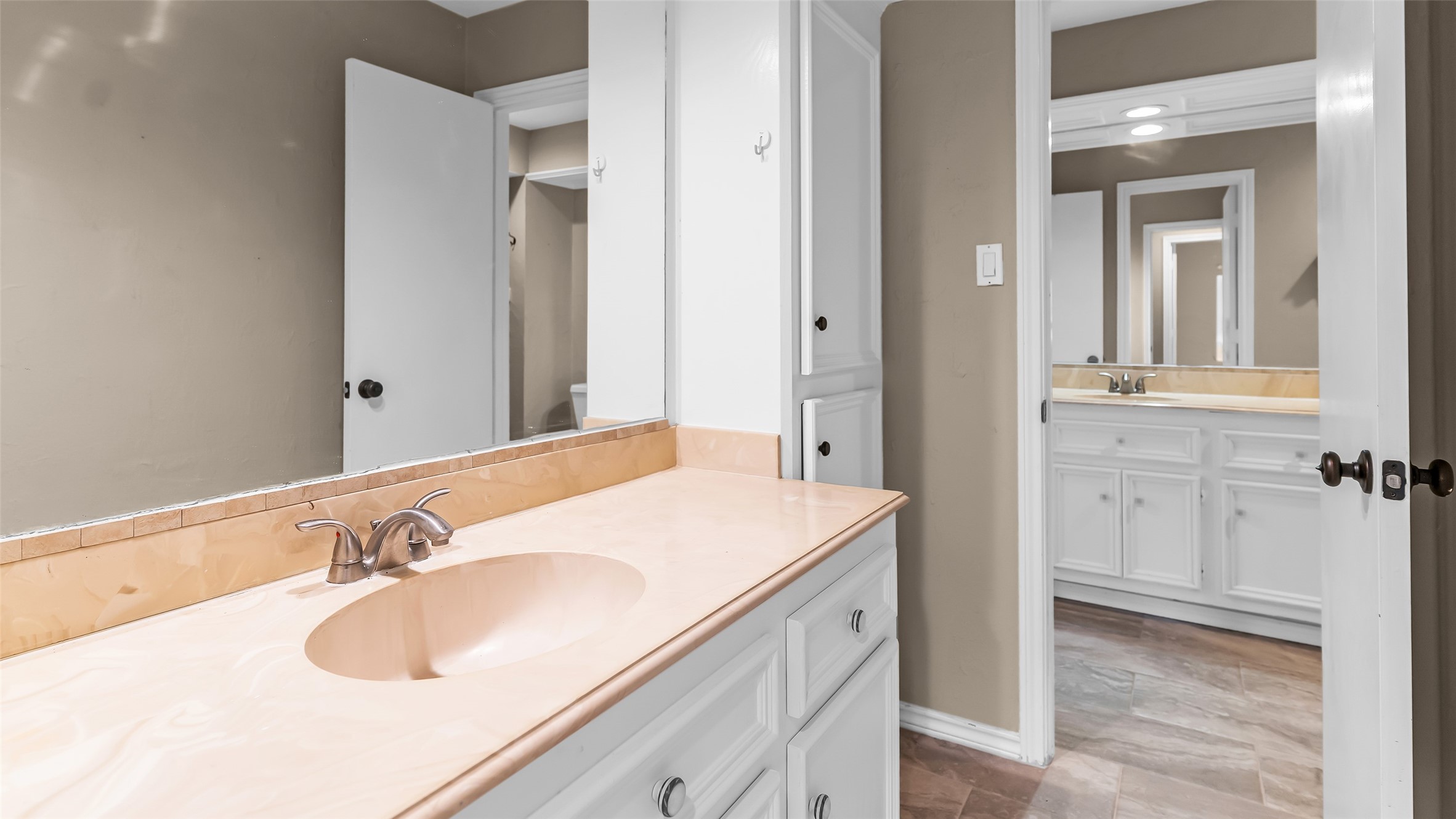 2607 Laurel Ridge Drive Houston, TX 77345 - Photo 34 of 47 a bathroom with a sink and a mirror