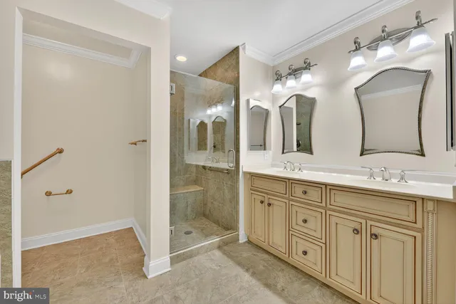 a bathroom with double sink and a mirror