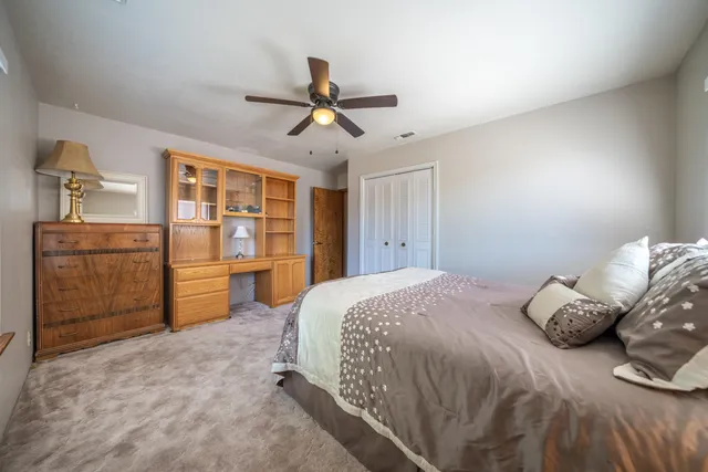 a bedroom with a bed and a cabinets