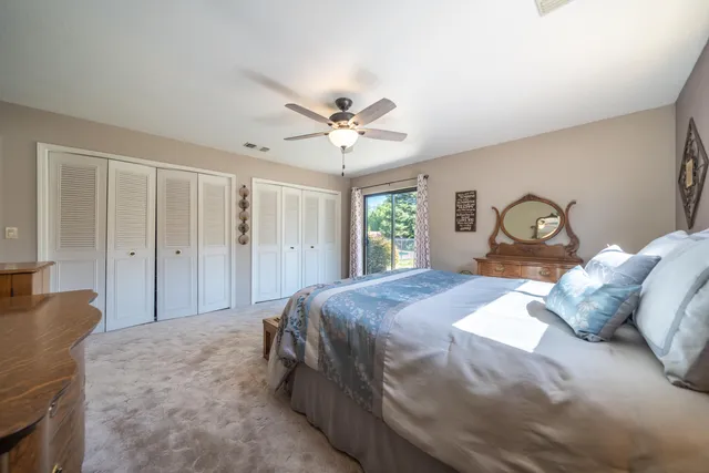a bedroom with a bed and window