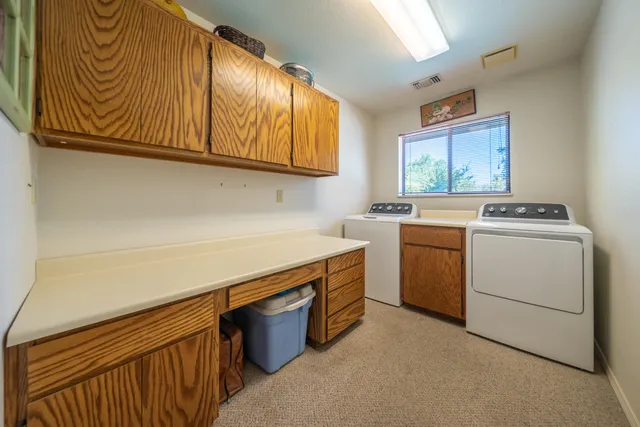 a utility room with washer and dryer