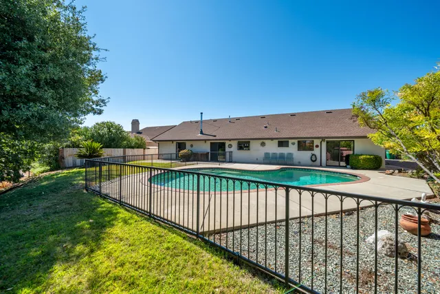 a view of a swimming pool with a patio