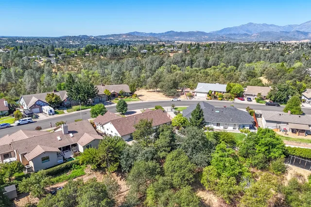 an aerial view of residential house with outdoor space