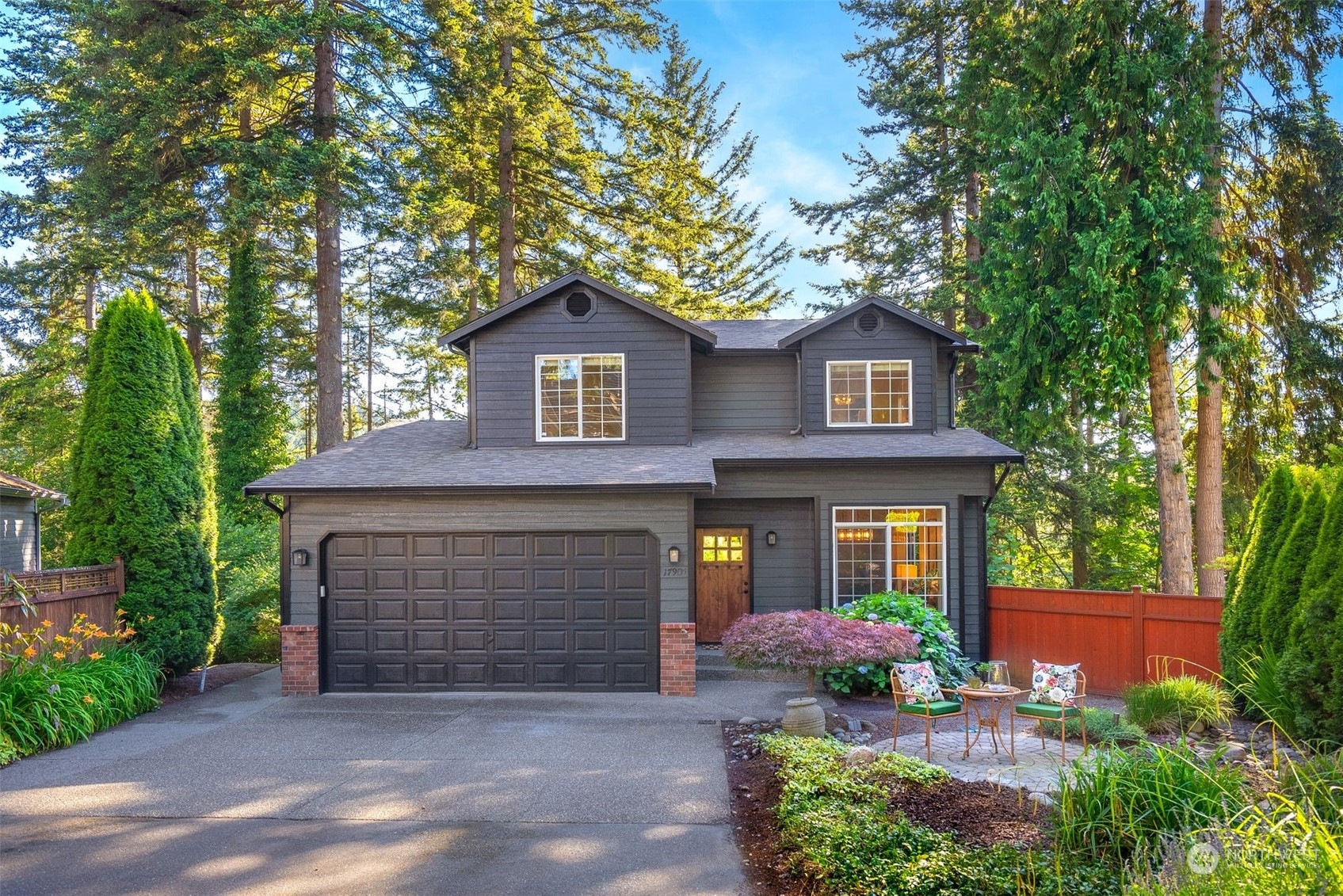 17905 Circle Drive Bothell, WA 98011 - Photo 1 of 39 a front view of a house with a garden