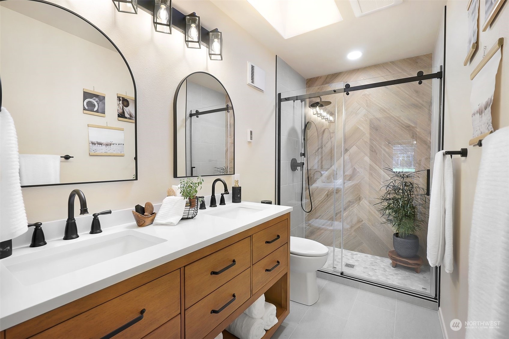 17905 Circle Drive Bothell, WA 98011 - Photo 14 of 39 a spacious bathroom with a double vanity sink toilet mirror and shower