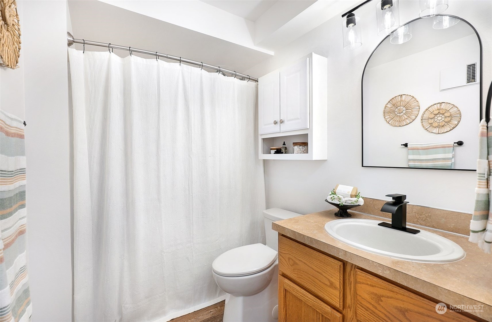 17905 Circle Drive Bothell, WA 98011 - Photo 28 of 39 a bathroom with a granite countertop sink mirror and toilet
