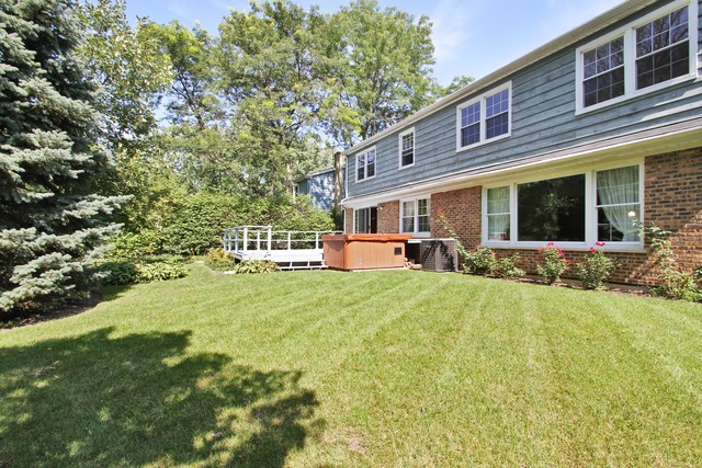 1728 Riverside Court Glenview, IL 60025 - Photo 17 of 18 a front view of house with yard