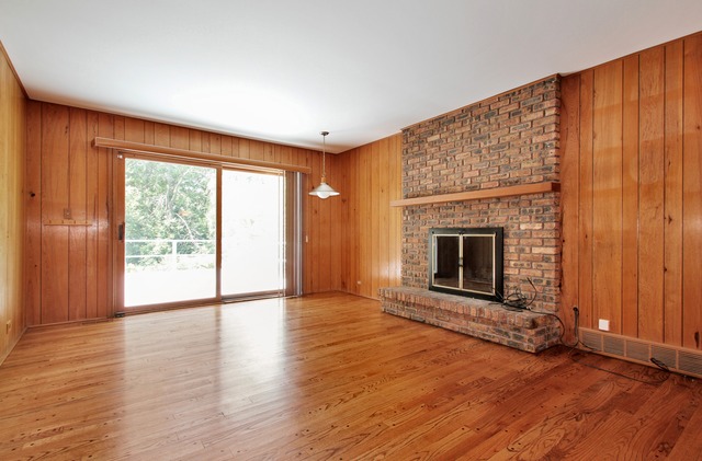 1728 Riverside Court Glenview, IL 60025 - Photo 7 of 18 a view of an empty room with a fireplace and a window