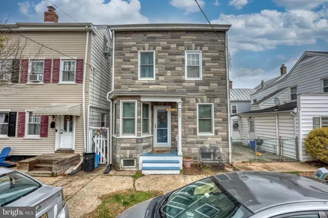 front view of a house with a large window