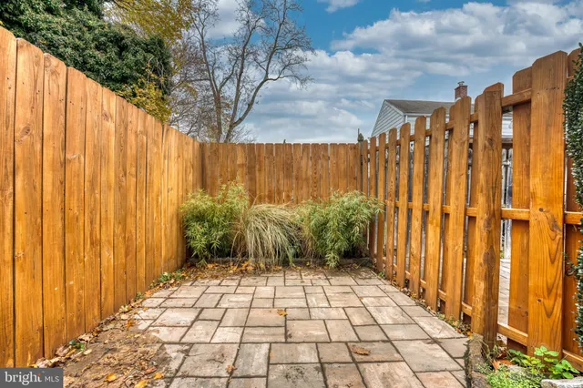 a view of a pathway with a garden