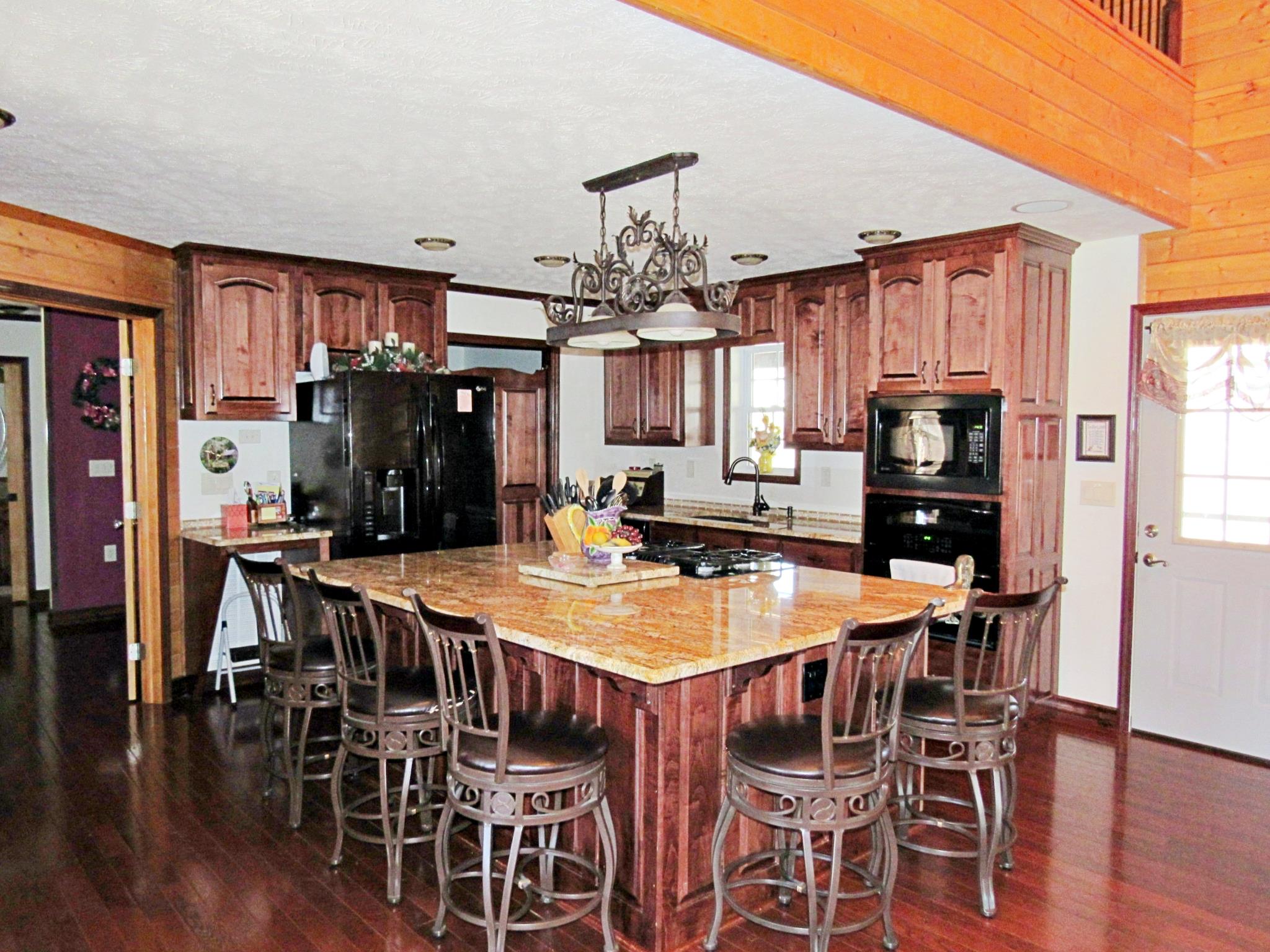 2486 Armstrong Road Linden, TN 37096 - Photo 8 of 30 Kitchen with beautiful bar custom cabinets