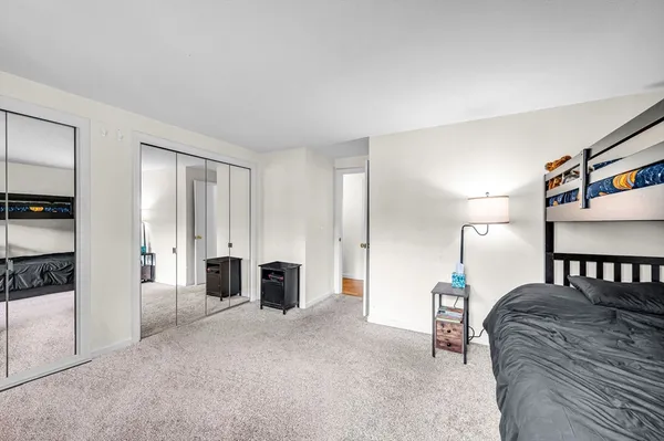 a bedroom with furniture and a fireplace