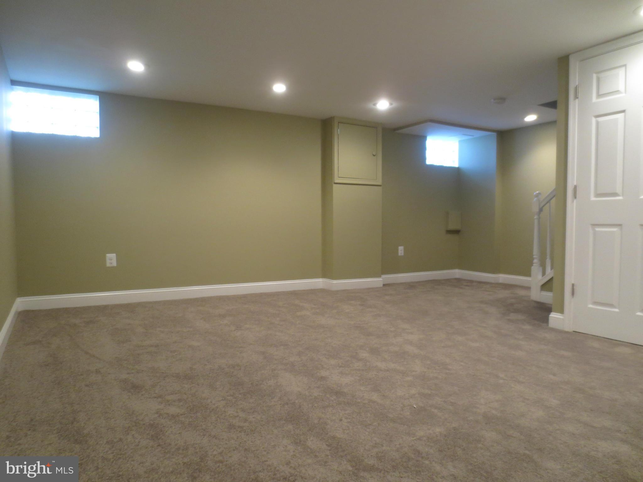 1801 Heathfield Road Baltimore, MD 21239 - Photo 17 of 28 an empty room with a empty space and windows
