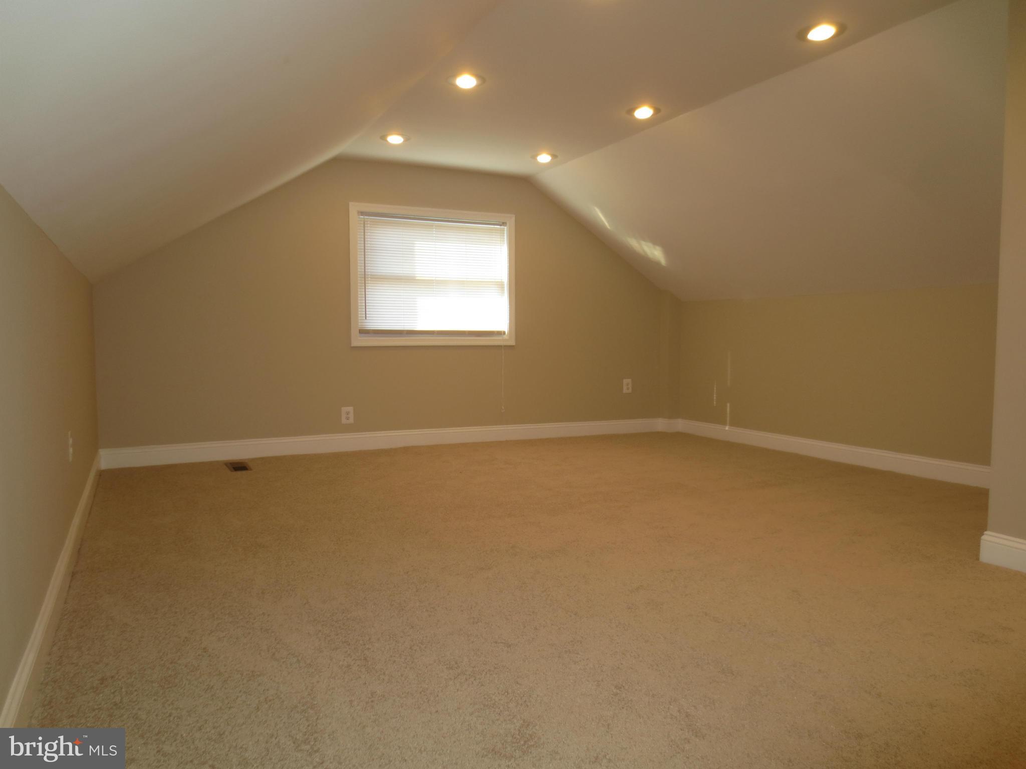 1801 Heathfield Road Baltimore, MD 21239 - Photo 22 of 28 a view of an empty room with a window
