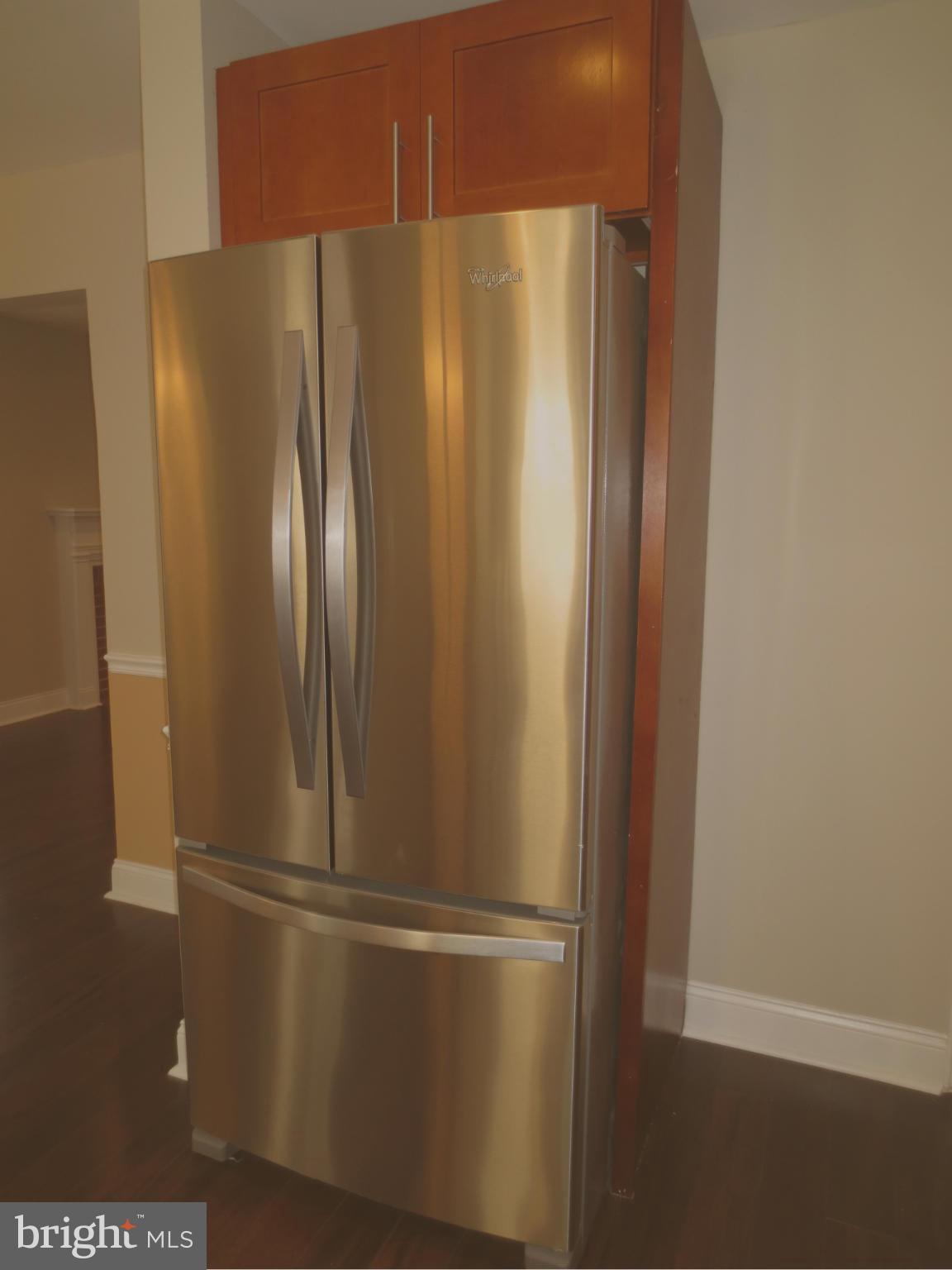 1801 Heathfield Road Baltimore, MD 21239 - Photo 26 of 28 a white refrigerator freezer sitting inside of a kitchen