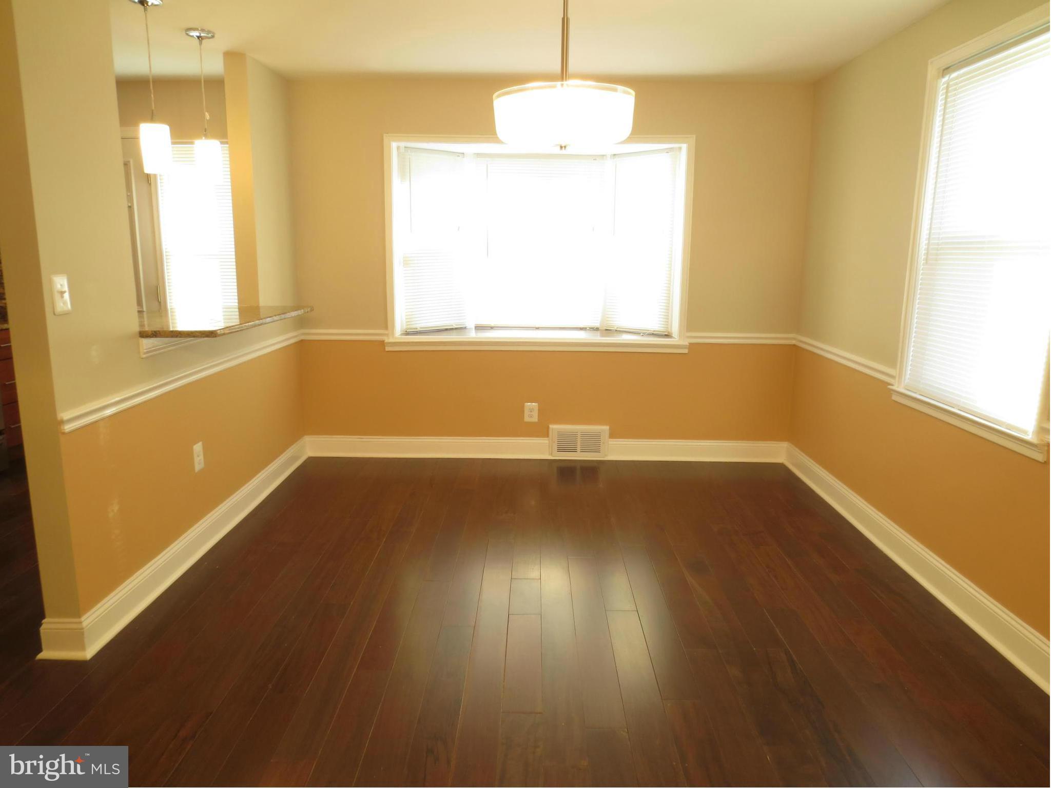 1801 Heathfield Road Baltimore, MD 21239 - Photo 8 of 28 a view of room with window and wooden floor