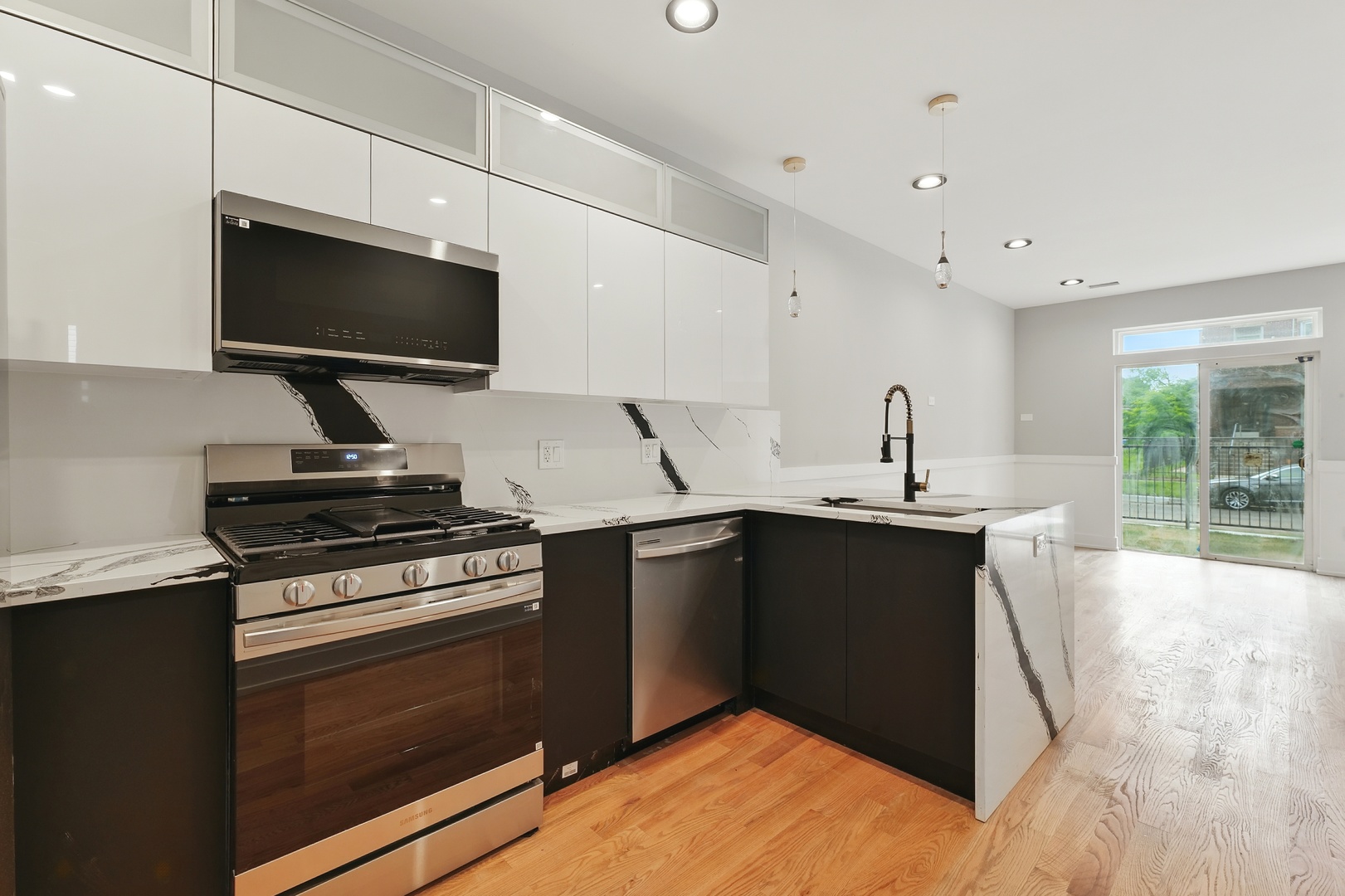 6327 South Langley Avenue, Unit 2 Chicago, IL 60637 - Photo 3 of 10 a kitchen with a stove and a microwave