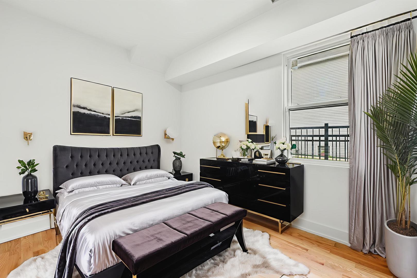 6327 South Langley Avenue, Unit 2 Chicago, IL 60637 - Photo 5 of 10 a bedroom with a bed and wooden floor