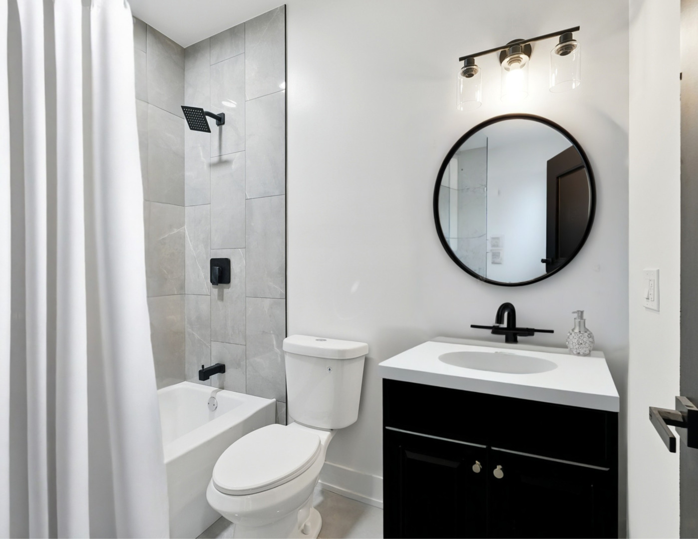 6327 South Langley Avenue, Unit 2 Chicago, IL 60637 - Photo 7 of 10 a bathroom with a sink a toilet and a mirror