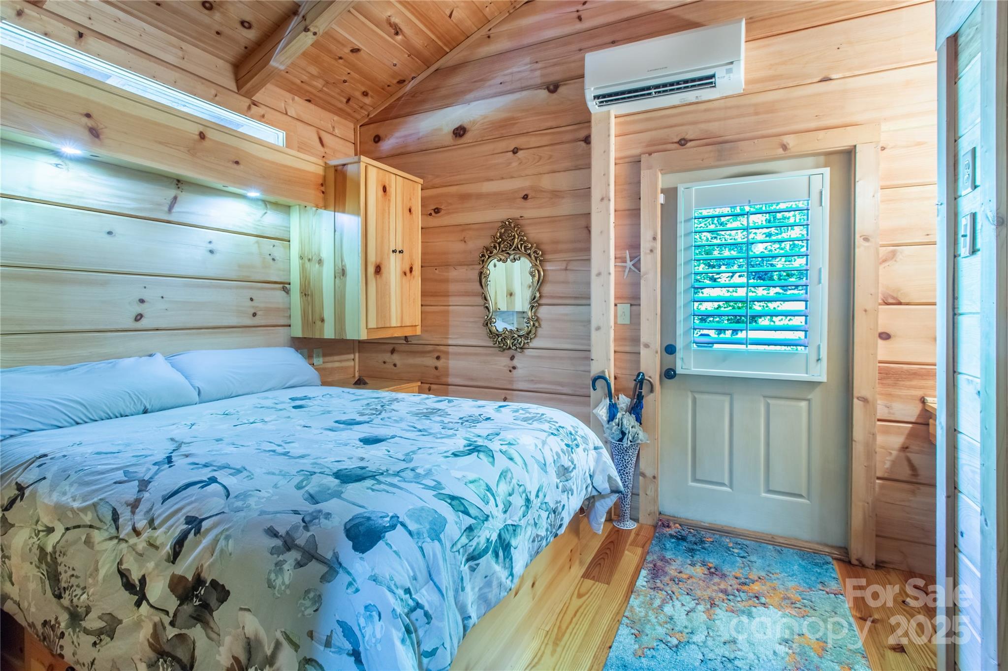 202 Duke Franklin Road Spruce Pine, NC 28777 - Photo 16 of 34 a bedroom with a bed and a dresser
