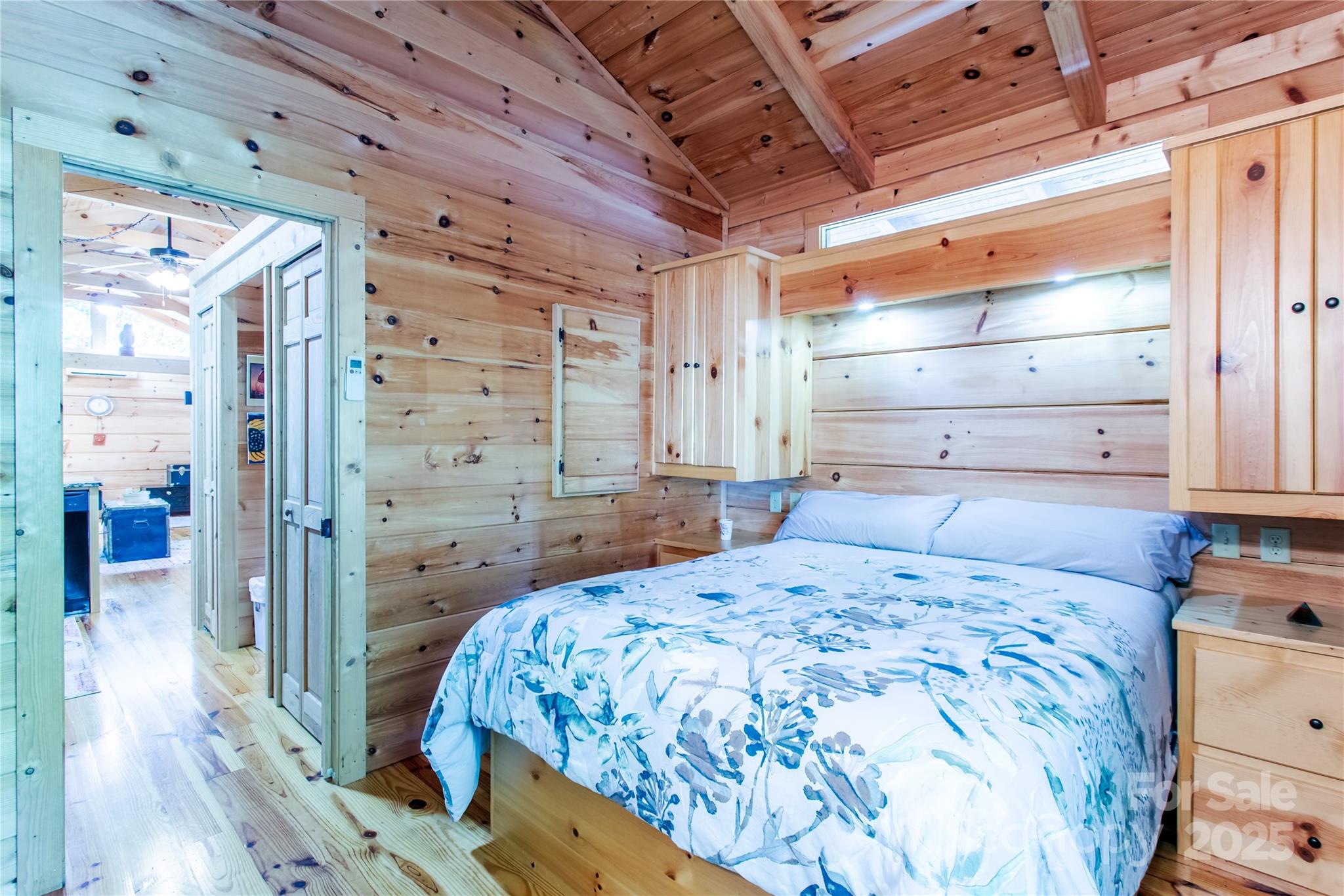 202 Duke Franklin Road Spruce Pine, NC 28777 - Photo 18 of 34 a bedroom with a bed and wooden floor