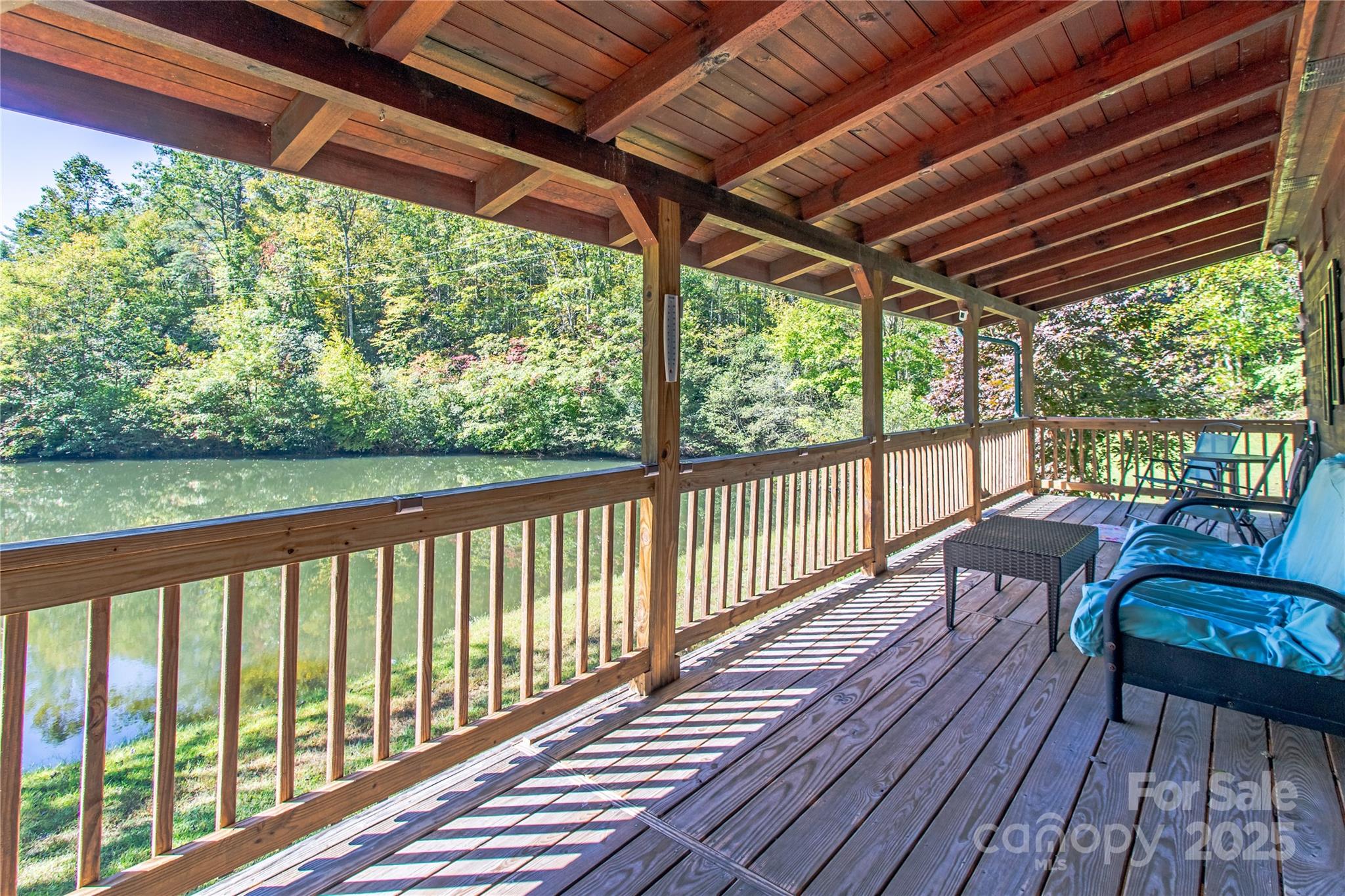 202 Duke Franklin Road Spruce Pine, NC 28777 - Photo 19 of 34 a view of a two chairs in the deck next to a yard