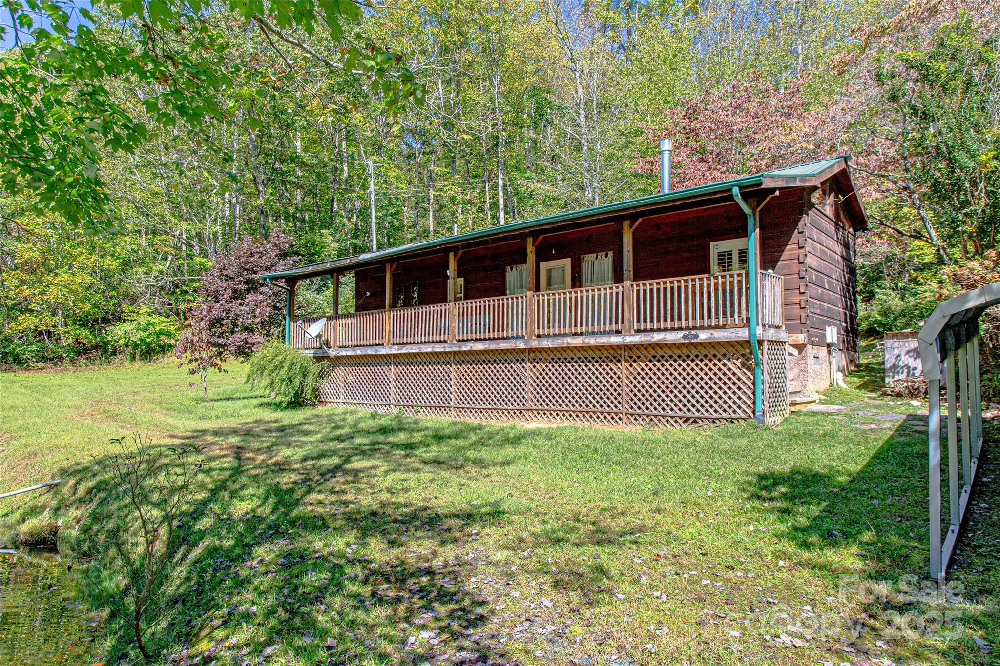 202 Duke Franklin Road Spruce Pine, NC 28777 - Photo 25 of 34 a view of a house with a yard