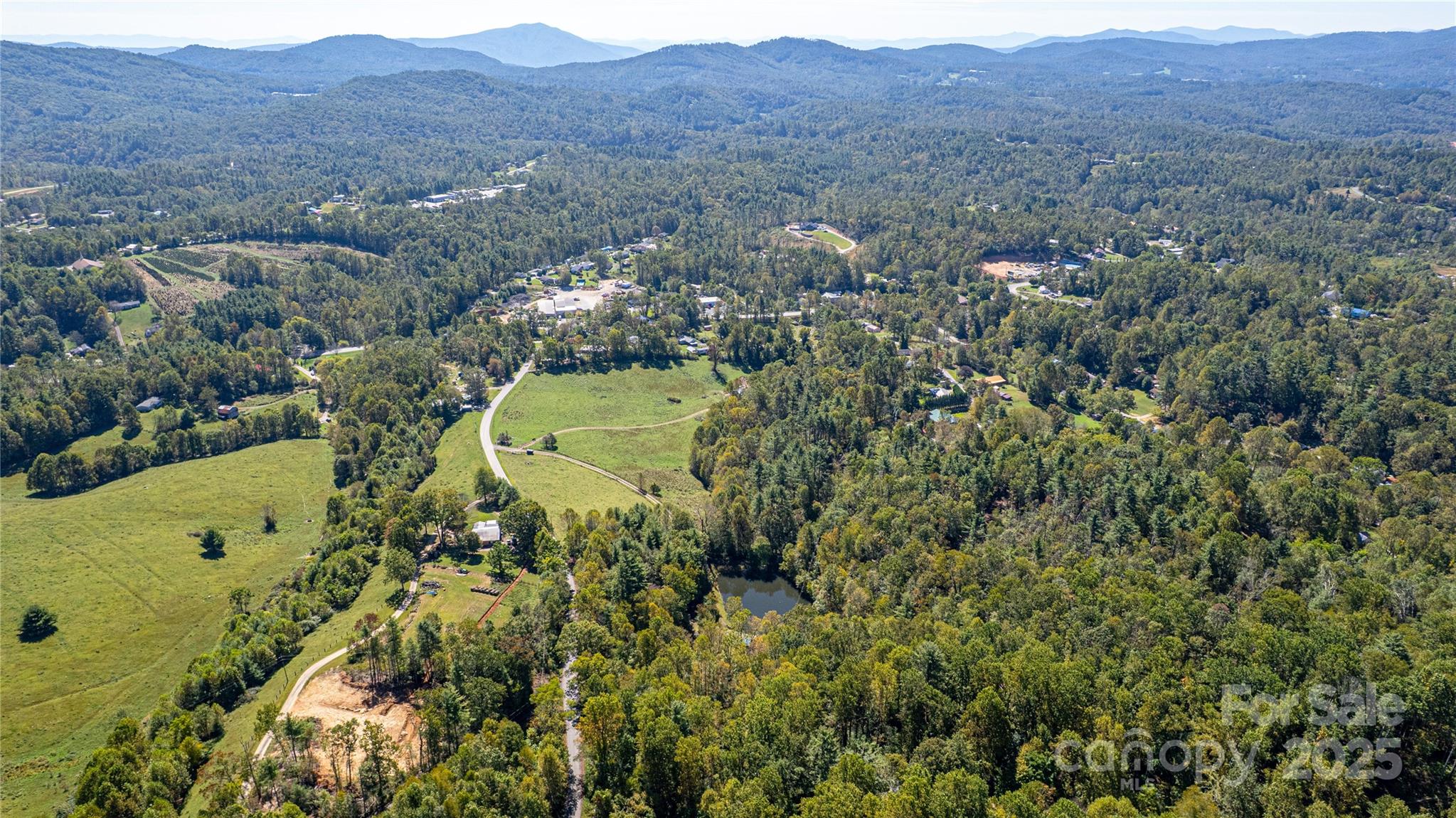 202 Duke Franklin Road Spruce Pine, NC 28777 - Photo 31 of 34 an aerial view of a residential houses and city view