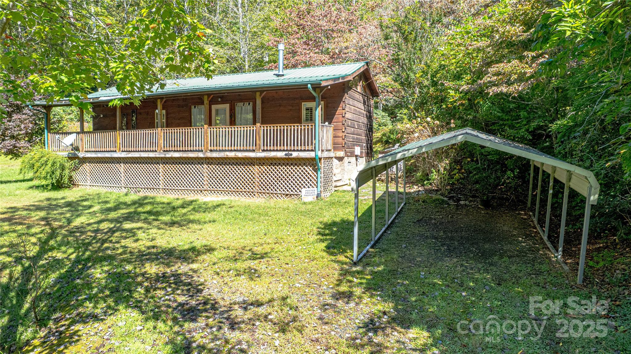 202 Duke Franklin Road Spruce Pine, NC 28777 - Photo 4 of 34 a house view with a backyard space