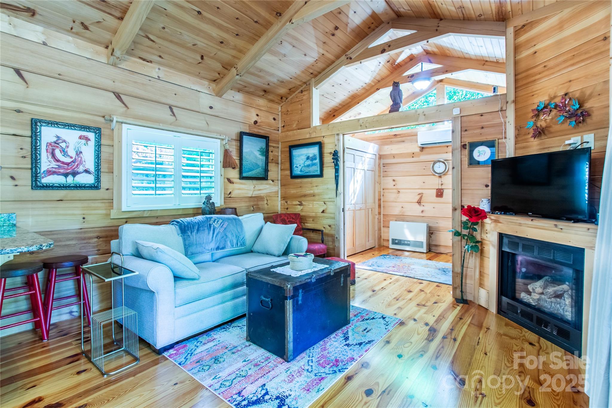 202 Duke Franklin Road Spruce Pine, NC 28777 - Photo 5 of 34 a living room with fireplace furniture and a flat screen tv