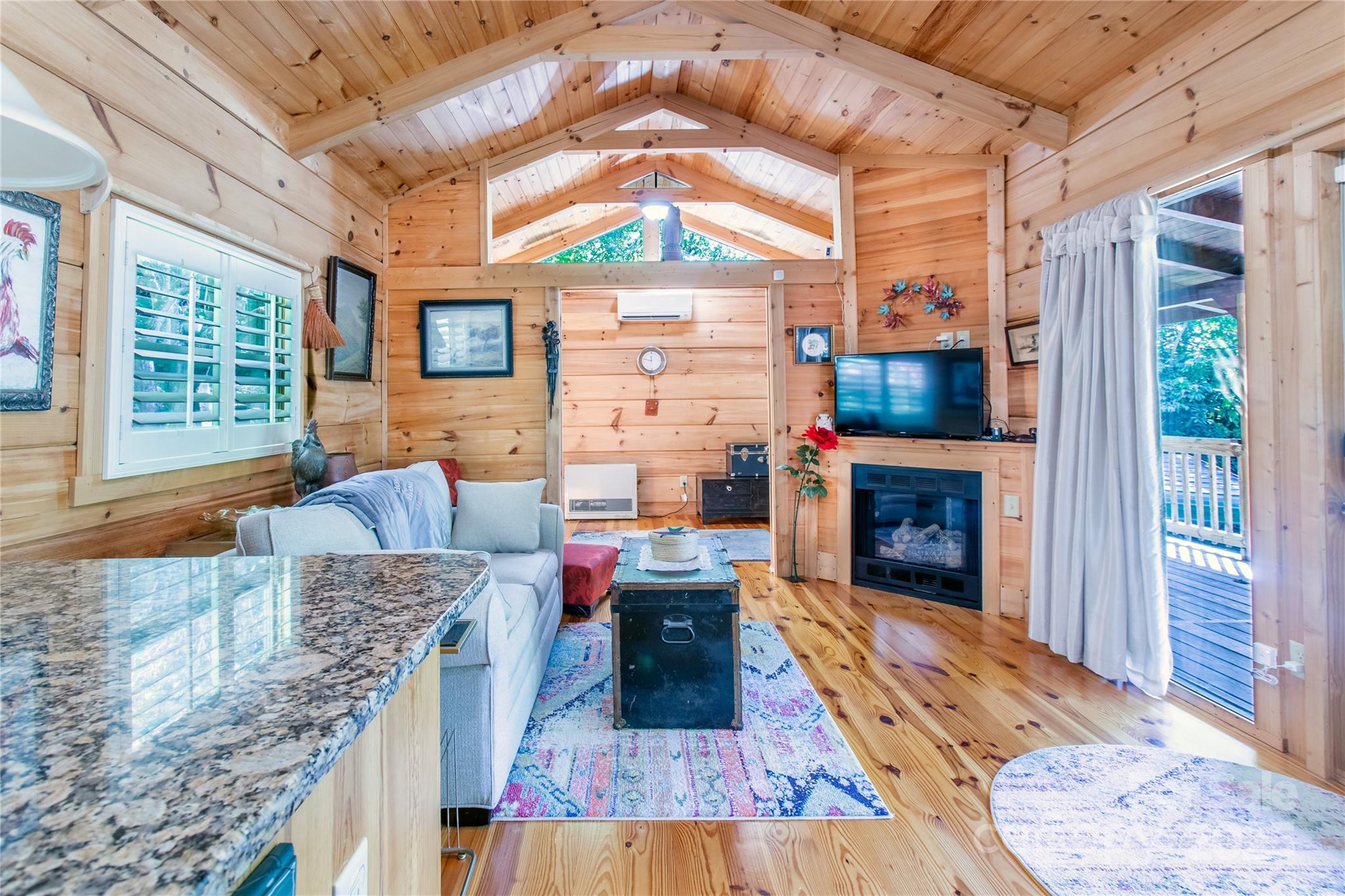 202 Duke Franklin Road Spruce Pine, NC 28777 - Photo 6 of 34 a living room with furniture and a fireplace