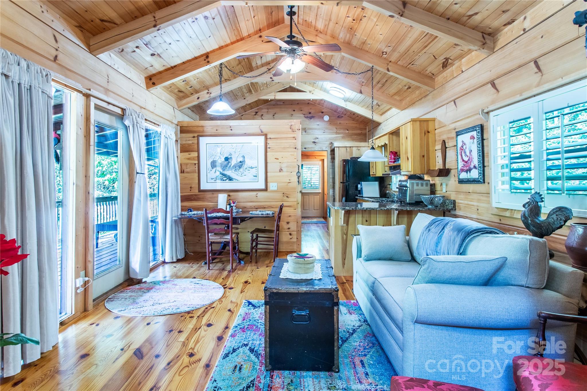 202 Duke Franklin Road Spruce Pine, NC 28777 - Photo 7 of 34 a living room with furniture and a large window