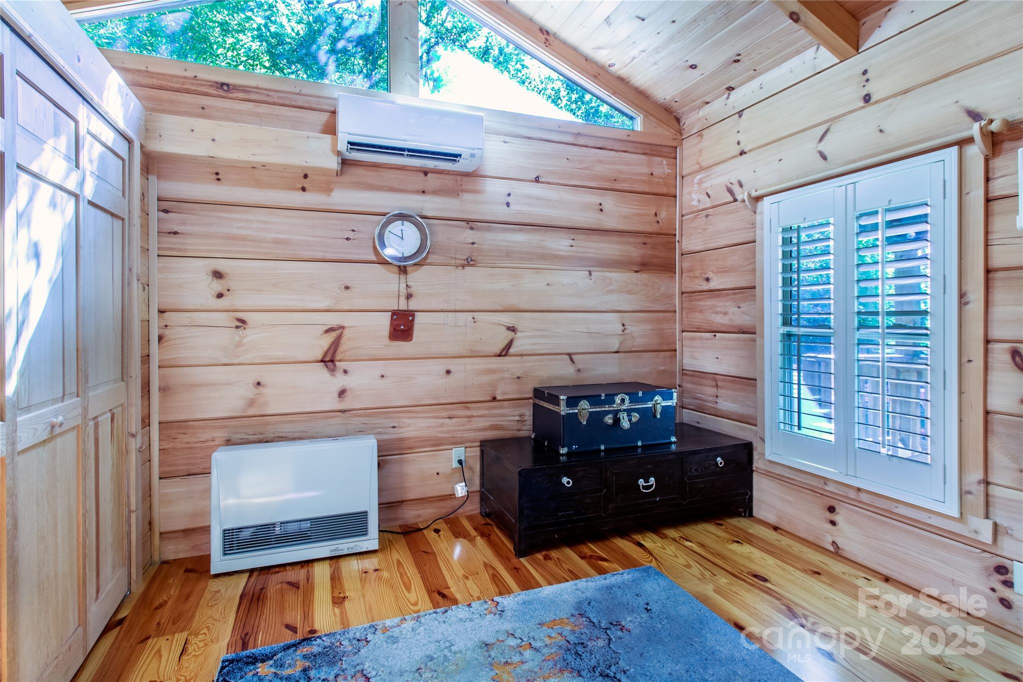 202 Duke Franklin Road Spruce Pine, NC 28777 - Photo 9 of 34 a living room with furniture and a fireplace