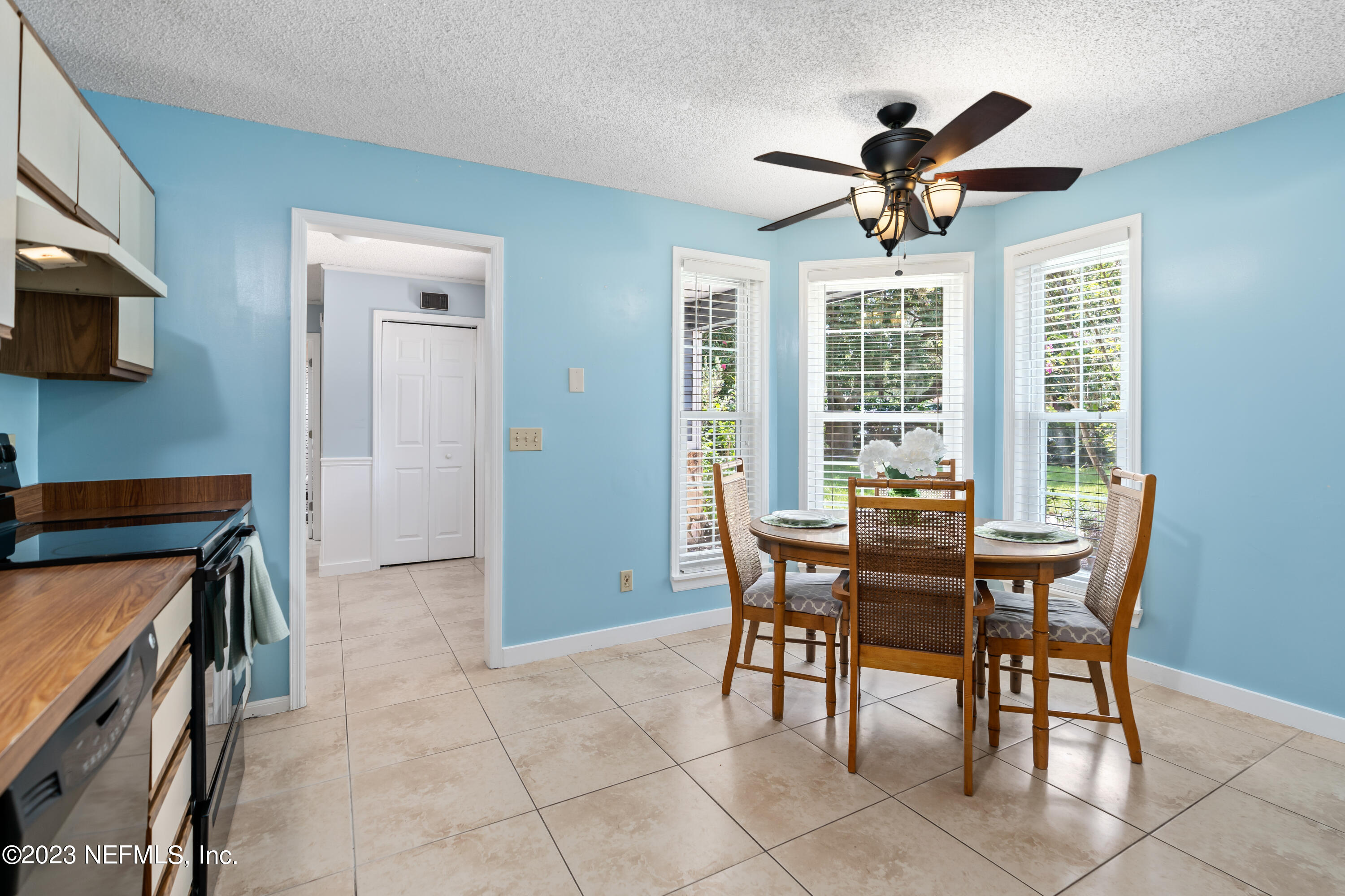 107 Heron Road St. Augustine, FL 32086 - Photo 12 of 39 a view of a dining room with furniture and a window