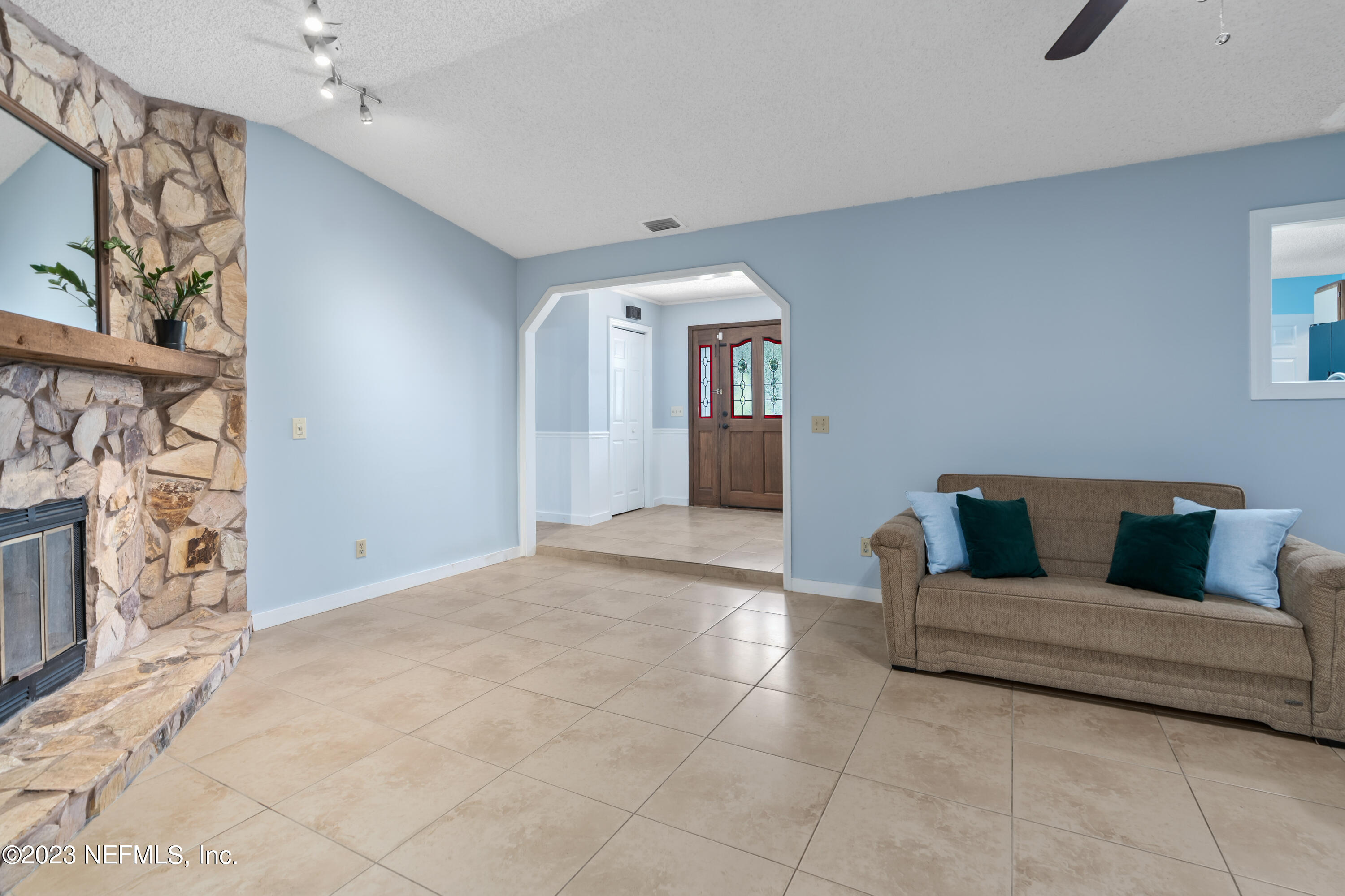 107 Heron Road St. Augustine, FL 32086 - Photo 16 of 39 a living room with furniture and a fireplace