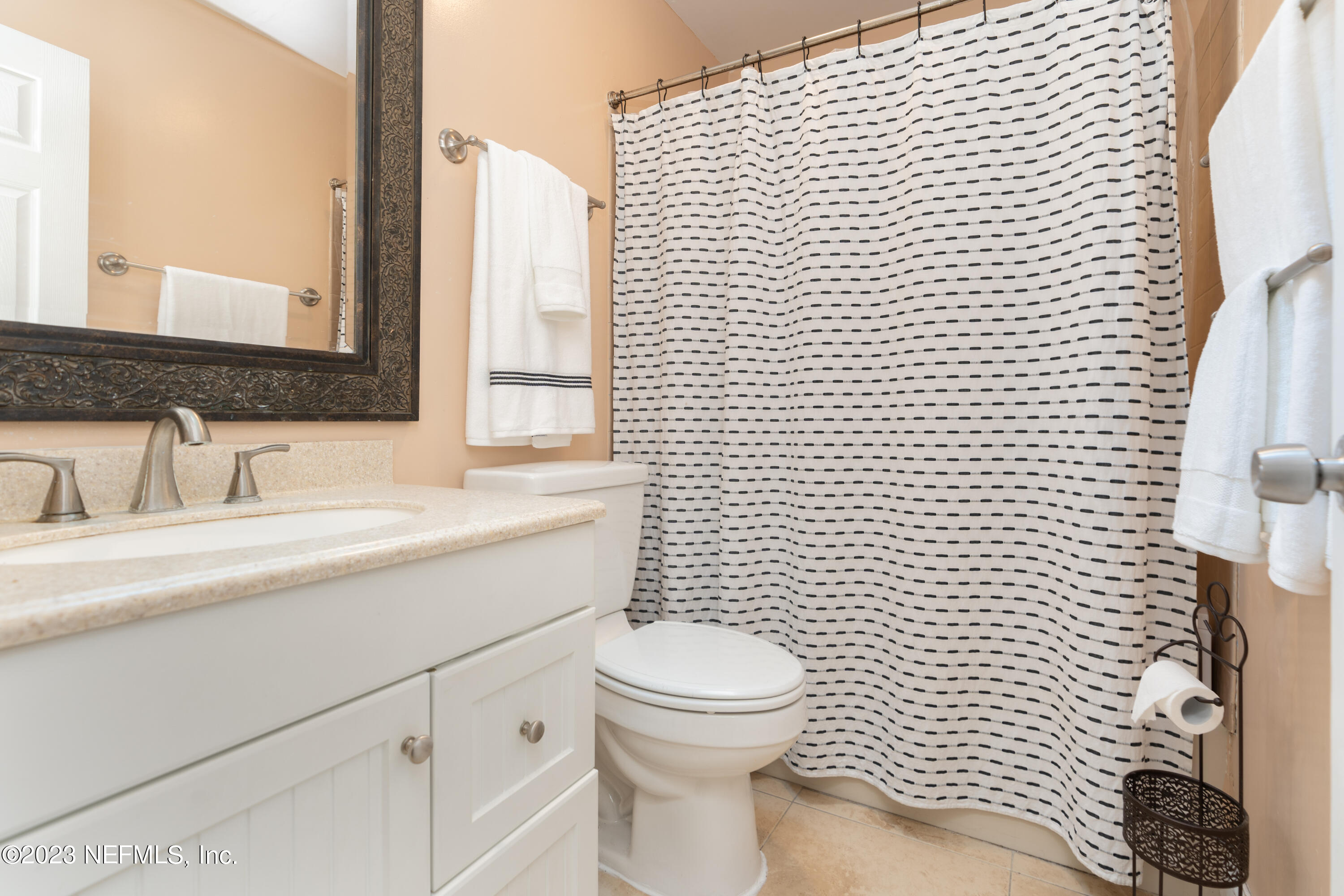 107 Heron Road St. Augustine, FL 32086 - Photo 19 of 39 a bathroom with a sink toilet and shower
