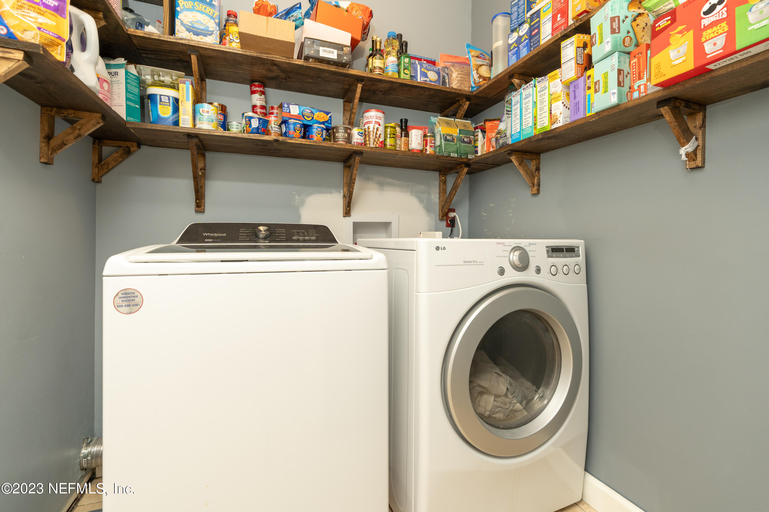 107 Heron Road St. Augustine, FL 32086 - Photo 28 of 39 a utility room with dryer and washer