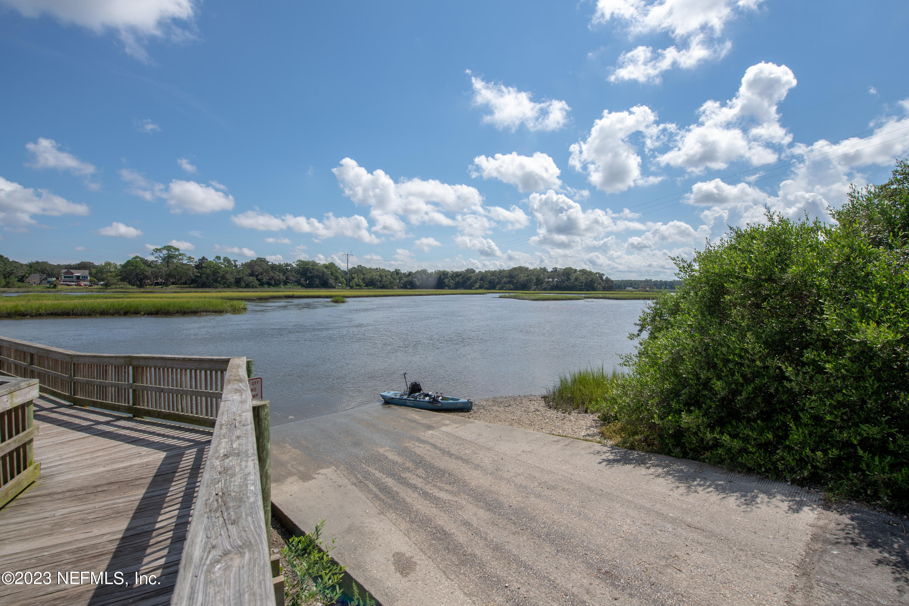 107 Heron Road St. Augustine, FL 32086 - Photo 38 of 39 a view of a lake with houses in back
